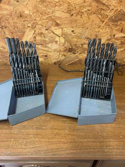 Lot of drill bits in metal holders