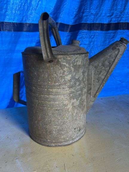 Old galvanized water can