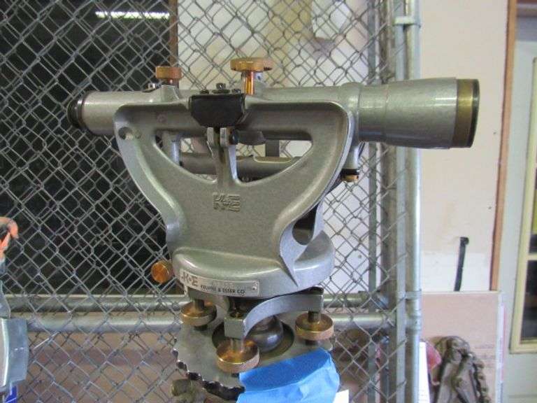 2 TRANSIT STANDS, MEASURING STICK AND A KEUFFEL AND ESSER CO. TRANSIT