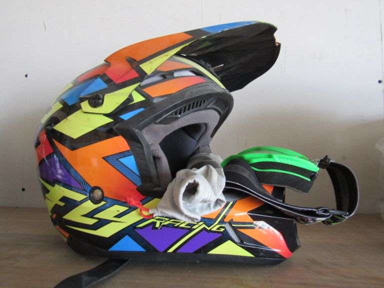 SMALL FLY RACING MOTORCYCLE HELMET AND PAIR OF 100% CLEAR GOGGLES