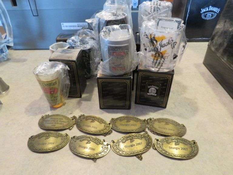 9 ASSORTED JACK DANIELS SHOT GLASSES AND 8 BOTTLE TAGS