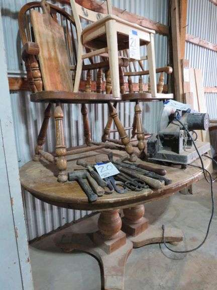 DINNING TABLE AND 3 WOOD CHAIRS AND A WOODEN CUTTING BOARD