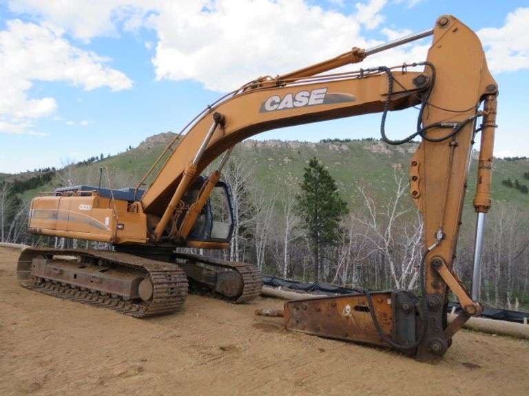 CASE 9050 EXCAVATOR - (located @ Gray Rd. & SD Hwy 34 location) - SELLS W/ BUCKET - 31.5" PADS - FAIR UNDERCARRIGE - RUNS AND OPERATES - SHES A WORK HORSE - S/N EACO5O1201 (THE HYDRAULIC BREAKER SELLS SEPERATLY FROM THE MACHINE - AND WILL BE REMOVED FROM THE MACHINE IF SELLING TO DIFFERENT BUYERS)