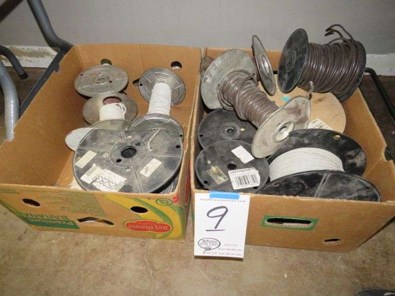 2 CASES OF WIRE UNDER THE TABLE