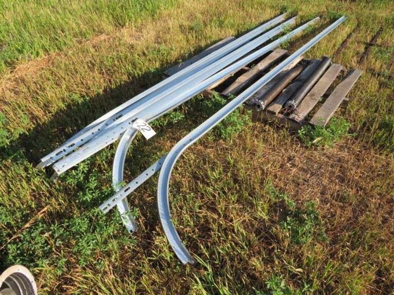 GROUP OF GARAGE DOOR RAILS AND TRACK, SMALL SECTION OF PANEL
