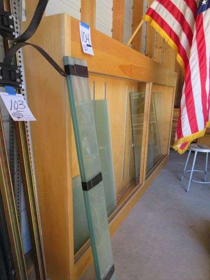 TROPHY CASE APPX 65 1/2" TALL X 12" DEEP X 10' LONG - COMES W/ GLASS AND SHELVING BRACKETS AND GLASS SHELVES - MIGHT NOT ALL BE HERE.
