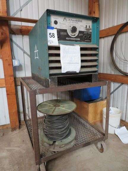 WELDER - 3 PHASE, W/ AIR PRODUCTS, DC, ARC WELDER, MODEL DC300HR S/N S421792, MOUNTED ON HEAVY CART - OPERATING CONDITION UNKOWN - SELLS WITH PARTIAL SPOOL OF NEW LEAD CABLE