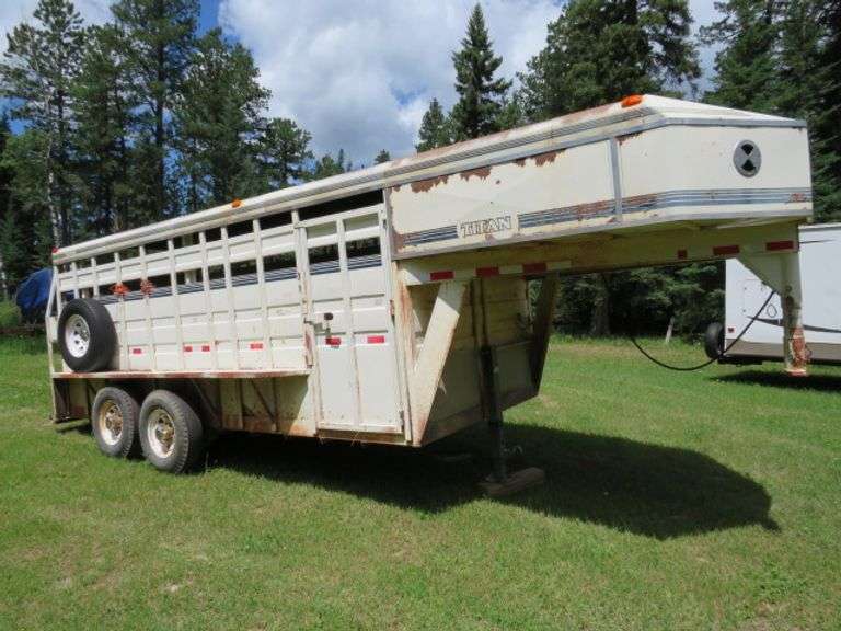TITAN GOOSENECK STOCK TRAILER WITH SIDE RAILS REAR COMBO GATE, CENTER GATE, SIDE ESCAPE DOOR 8 HOLE 16" TIRES - SELLS WITH TITLE - LOST TITLE HAS BEEN APPLIED FOR - TEMP PLATE WILL BE AVAILABLE FOR THE BUYER