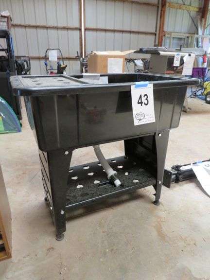 UTILITY SINK NEVER USED, BLACK PLASTIC 30" TALL X 32" WIDE X 22 1/2" DEEP