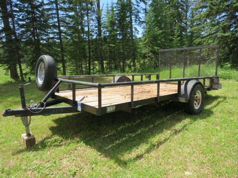 TEXAS BRAG EQUIP. SINGLE AXEL TRAILER - INSIDE MEASUREMENT 80"X14' - 5 HOLE 15" WHEELS - REAR RAMP GATE - TRAILER HAS WOOD FLOOR LOOKS TO BE REAL GOOD - WHEEL BEARINGS MAY NEED WORK, MIGHT BE BEST TO HAUL IT HOME - 2" HITCH - FLAT 4 LIGHT PLUG