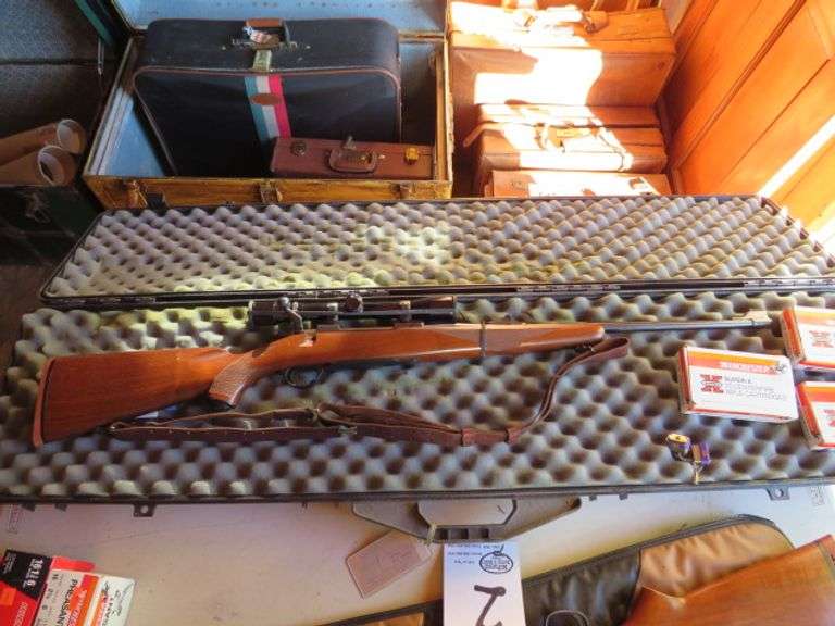 RUGER M 77 BOLT ACTION 30-06 RIFLE SER. # 70-25138 WITH OPTIMA 4X32 SCOPE SELLING WITH HARD CASE ALSO INCLUDES 50 ROUNDS OF AMMO - GUN DOES HAVE SOME RUST FROM STORAGE