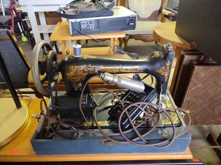 Singer sewing machine with cover Metzger Property Services, LLC