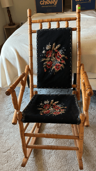 Turned wood rocker with needlepoint seat and back 19x36"