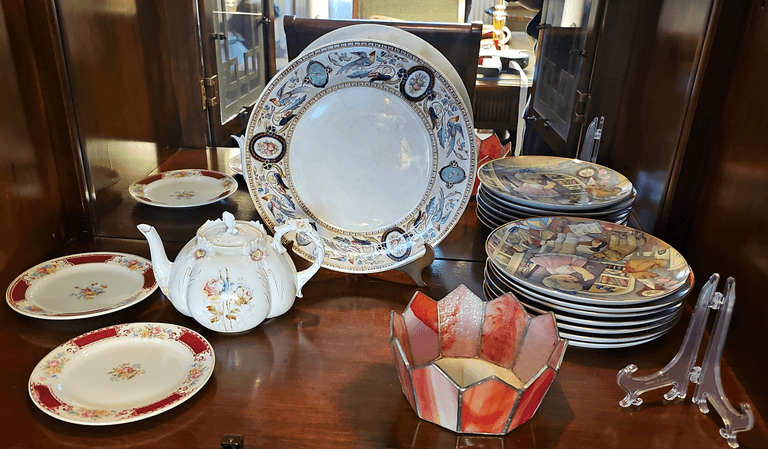 Stained Glass Trinket Dish, (2) Homer Laughlin Floral Pattern Plates, Floral Tea Pot, (7) Carol Lawson plates, etc. 4-12”