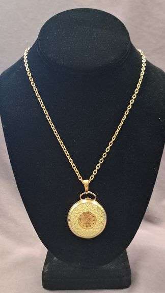 Bercona Swiss made watch pendant on gold tone necklace