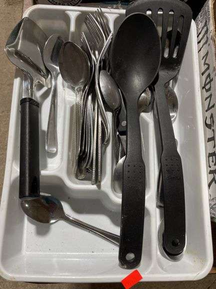 Kitchen utensil assortment including flatware spatula in drawer