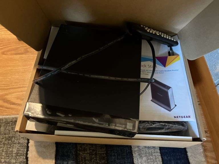 Netgear router, Magnavox DVD player - Metzger Property Services, LLC