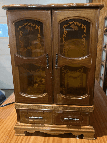Jewelry cabinet w/ some jewelry pieces 10x15x5"
