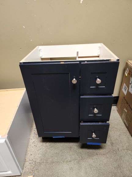Vanity Cabinet in blue 25" W x 18" D x 34"H is damaged