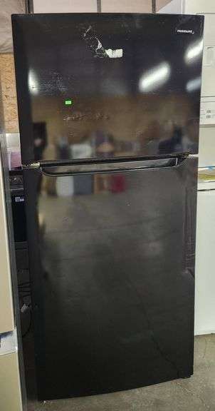 Frigidaire 30 in. 18.3 cu. ft. Garage Ready Top Freezer Refrigerator in Black model # FFRT1835VBE has dings and scuffing  on front