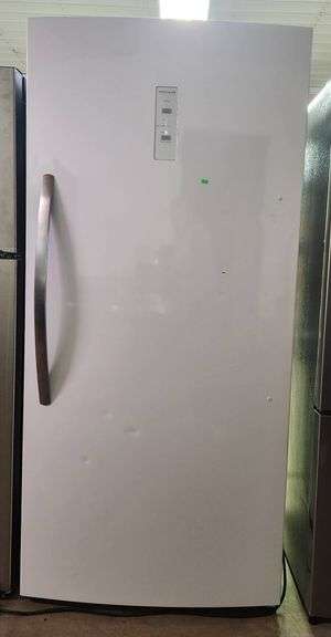 Frigidaire 33 in. 20 cu. ft. Freezerless Refrigerator in White with Temperature Alarm ENERGY STAR model # FRAE2024AWC has dings on front