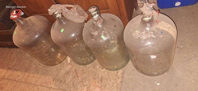 Four 5gal Clear Glass Carboys - Metzger Property Services, LLC