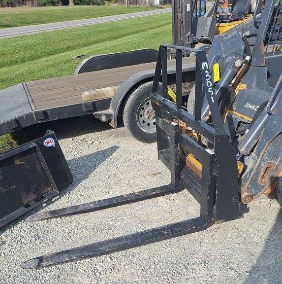 Skidloader pallet forks - Metzger Property Services, LLC