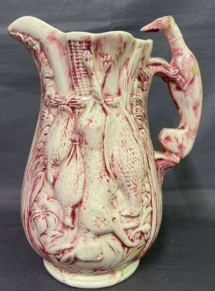 Pitcher with Game Motif and Hound Handle – has been repaired on the spout 10”