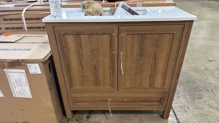Home Decorators Collection
Moorside 36 in. Single Sink Sweet Maple Bath Vanity with White Engineered Stone Top has cracked top