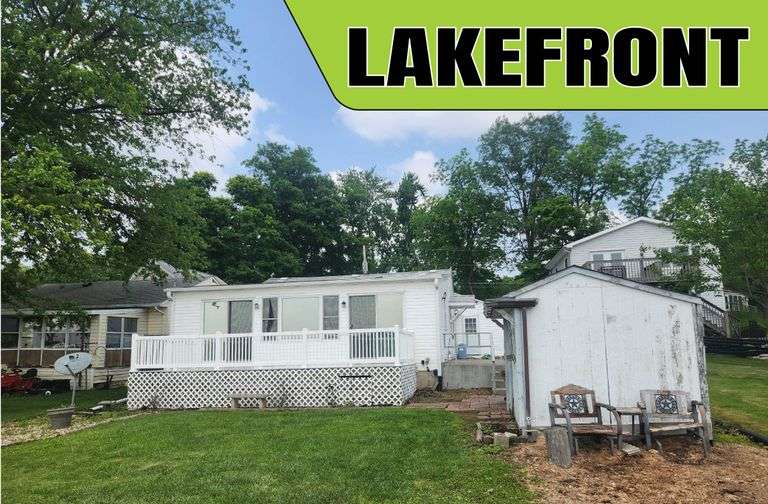 7.23.25 - LIVE & ONLINE REAL ESTATE AUCTION -- LAKEFRONT COTTAGE with 48' of Frontage & 2-Car Garage on Blue Lake in Churubusco, IN