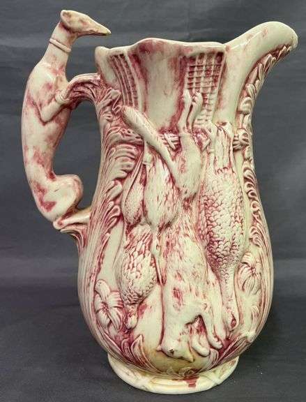 Pitcher with Game Motif and Hound Handle – has been repaired on the spout 10”
