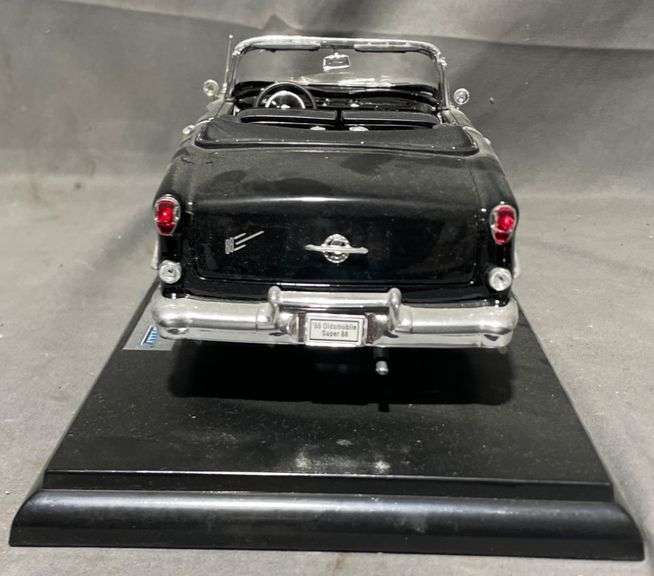 1955 Oldsmobile Super 88 Convertible Diecast Model on Display Base