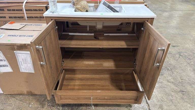 Home Decorators Collection
Moorside 36 in. Single Sink Sweet Maple Bath Vanity with White Engineered Stone Top has cracked top