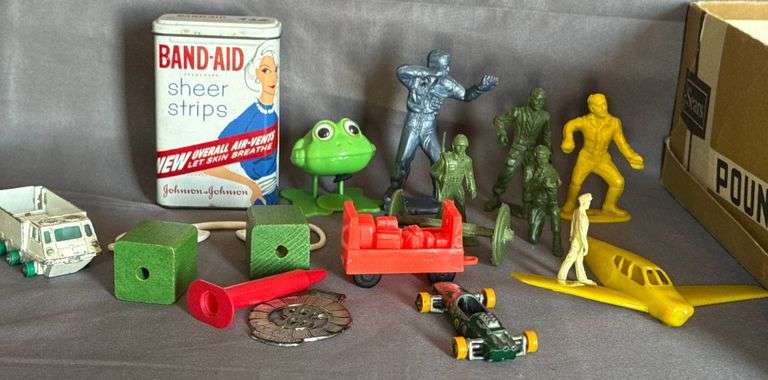 Plastic Toys and Band-Aid Tin