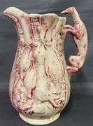 Pitcher with Game Motif and Hound Handle – has been repaired on the spout 10”