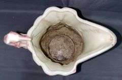 Pitcher with Game Motif and Hound Handle – has been repaired on the spout 10”