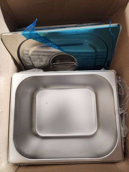 Stainless Steel Food Pans with Lids and Assorted Kitchen Items