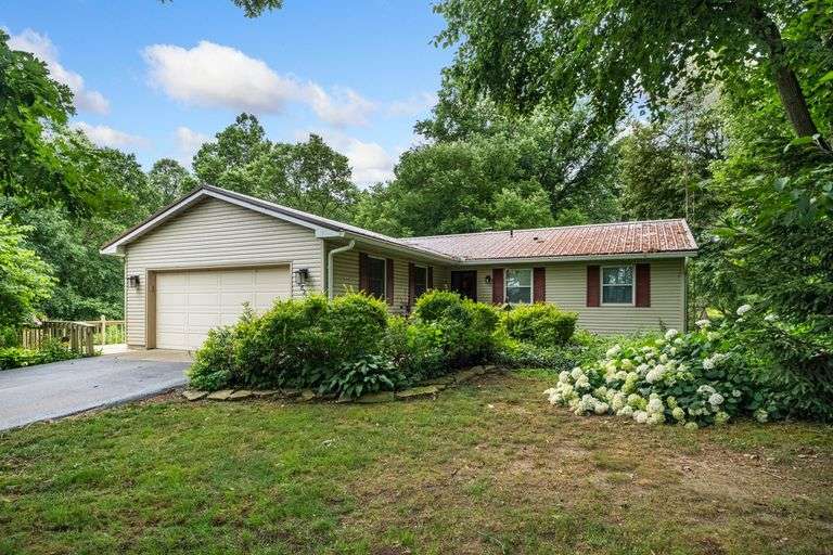 RANCH HOME WITH 2-CAR GARAGE ON WOODED 2.7+/- ACRE LOT
