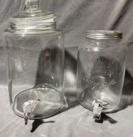 Two Clear Glass Beverage Dispensers with Spigots and Lids