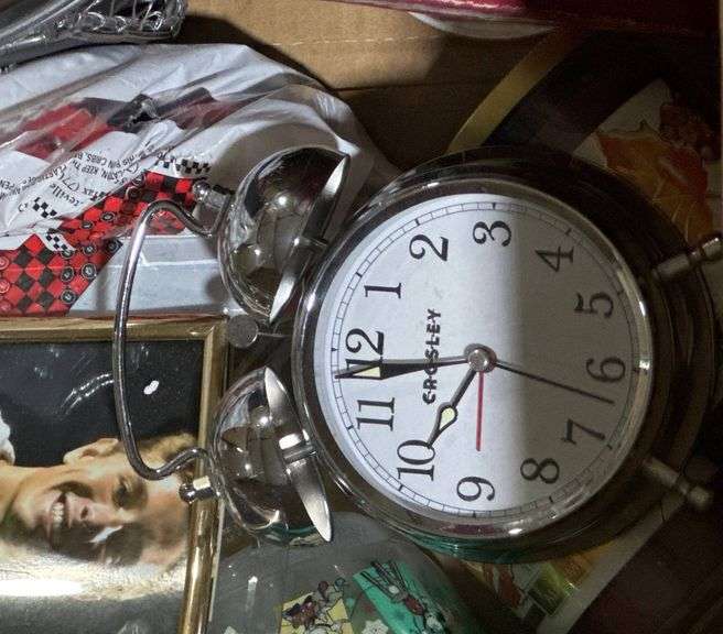 Household Items Including Candles, Egg Plate, and Alarm Clock