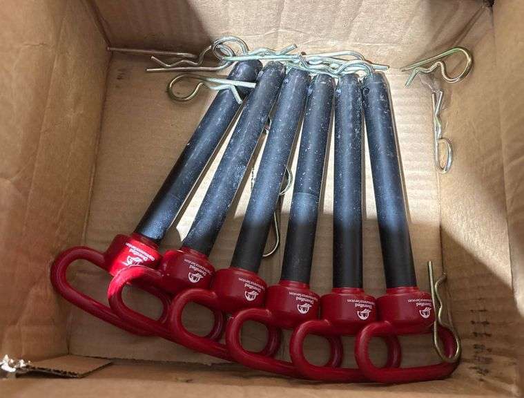 Ten Ground Anchors with Red Handles and Metal Stakes