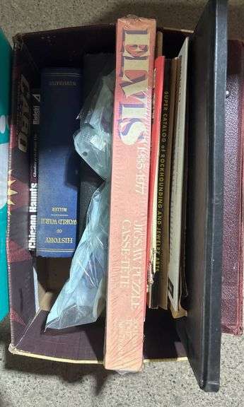 Household Items Including Books, Puzzle, and Display Accessories