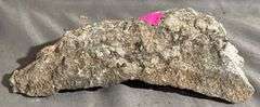 Rough Mineral Specimen with Metallic Inclusions