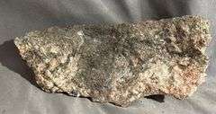 Rough Mineral Specimen with Metallic Inclusions