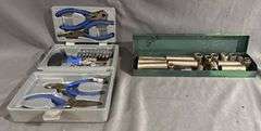 Two Toolkits Featuring Pliers, Sockets, and Bits in Metal and Plastic Cases