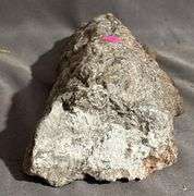 Rough Mineral Specimen with Metallic Inclusions