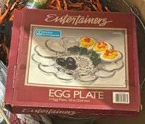 Household Items Including Candles, Egg Plate, and Alarm Clock