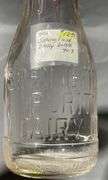 Clear Glass Springfield Dairy Bottle with Embossed Lettering, 7″