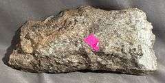 Rough Mineral Specimen with Metallic Inclusions