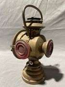 The Neverout Railroad Regulated Kerosene Safety Lamp with Red Lenses